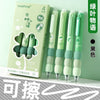A box of four green erasable gel pens with soft grips and black ink, shown next to the product.