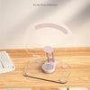 A clear silicone anti-slip pad with grooves and a pink base for a tablet or phone stand.