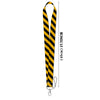 Black and yellow striped vintage cassette tape lanyard with a metal clip.