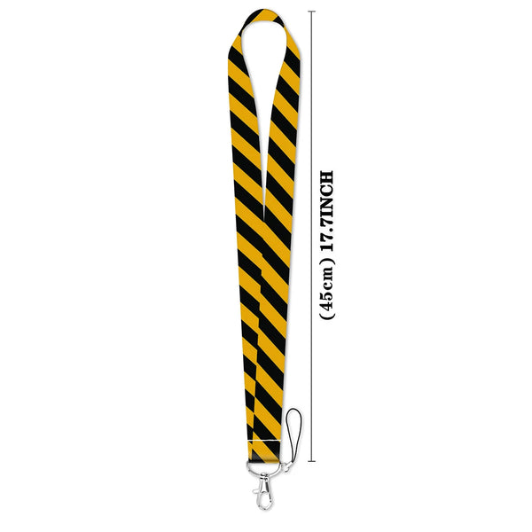 Black and yellow striped vintage cassette tape lanyard with a metal clip.