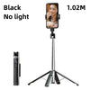 A black Bluetooth selfie stick tripod with a camera mounted on top.