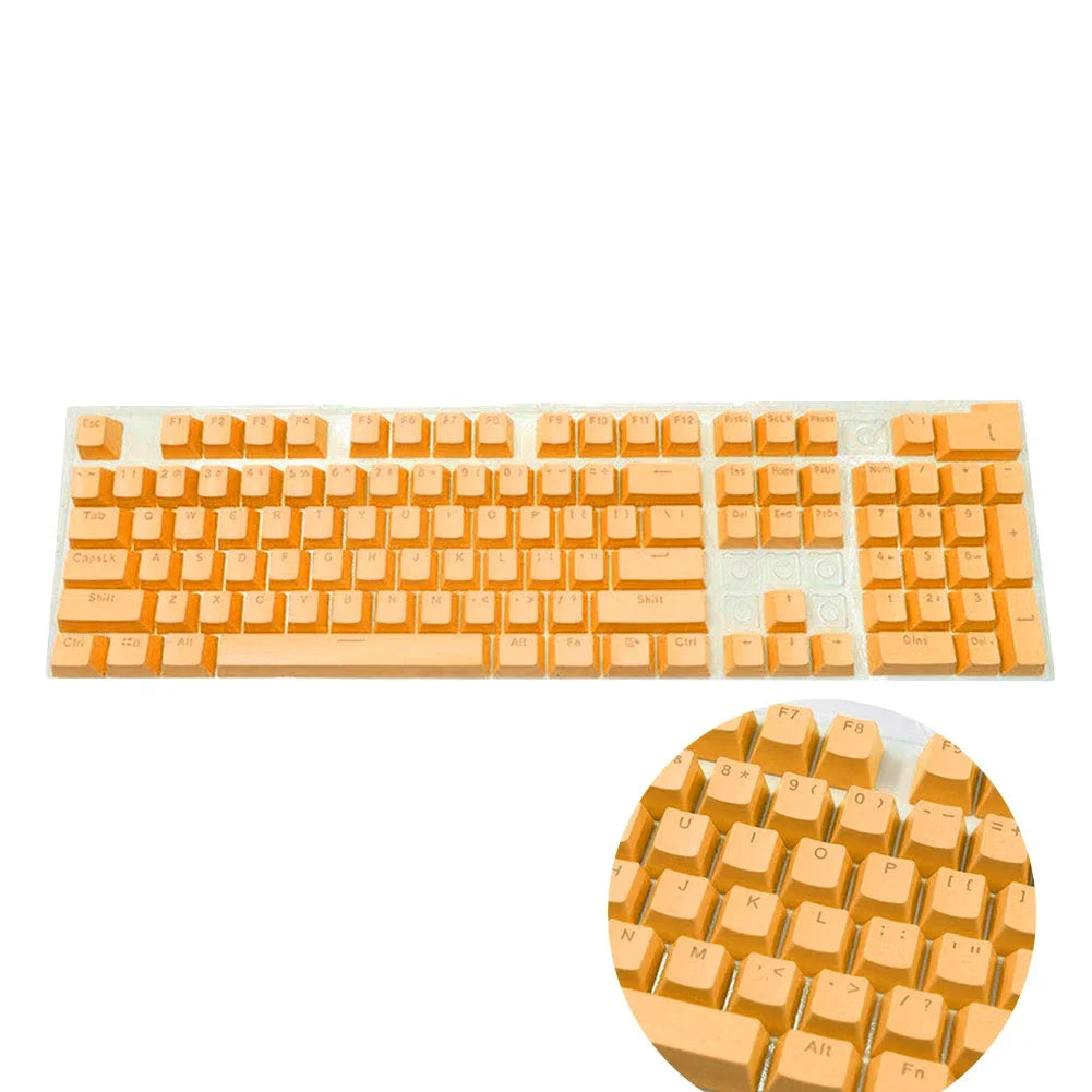 A set of orange mechanical keyboard keycaps for a 104-key backlit ABS keyboard.