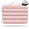 A pink protective laptop sleeve bag featuring quilted padding and a carrying loop.
