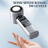 A hand holds a mini USB powered cold fan with a digital display, showing its adjustable wind speed settings.