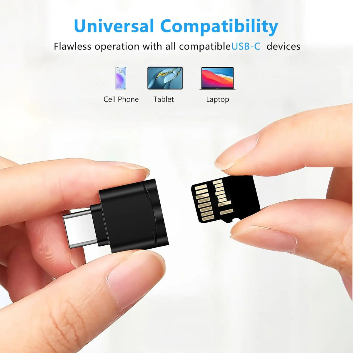 A hand holds a black USB-C to SD/TF card reader with a keychain attachment.