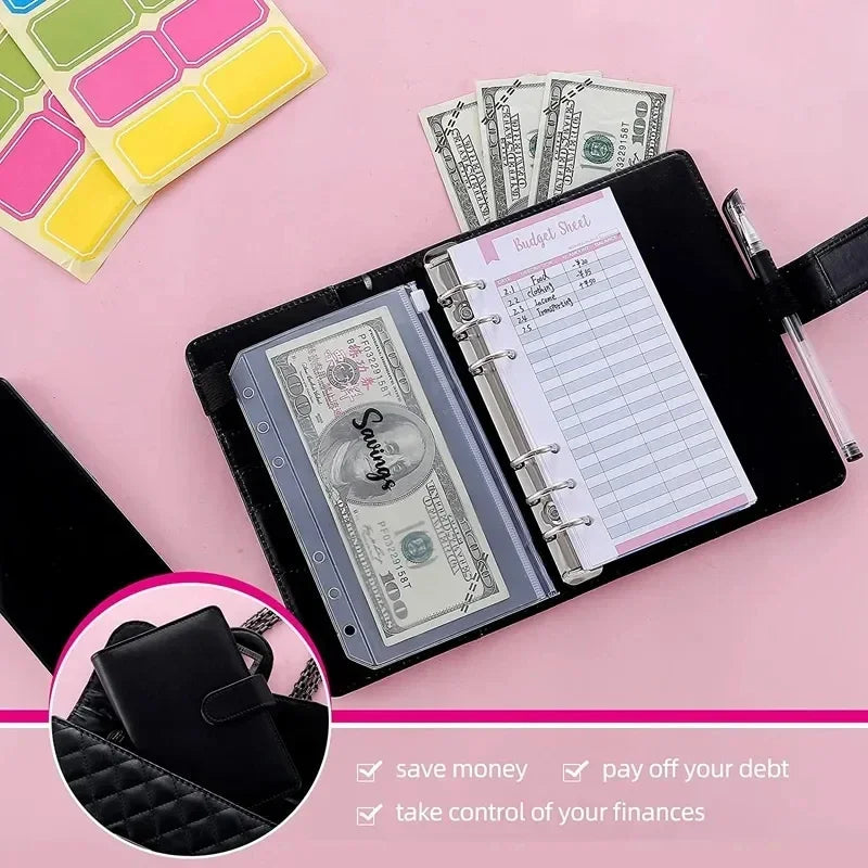 A pink background shows an A6 budget planner with a leather cover, a stack of cash, and a pen.