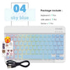 A white portable keyboard set with light blue keys, a USB cable, and a sticker included.