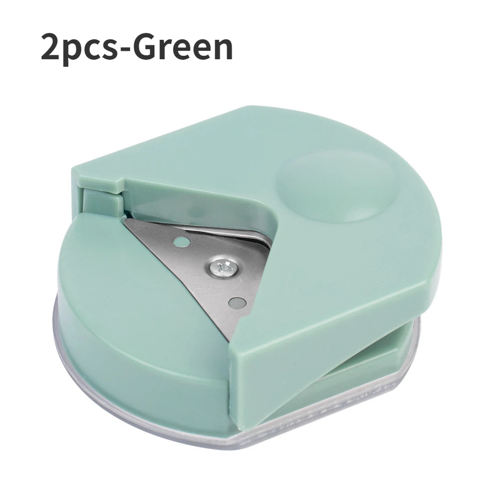 A pair of green precision corner cutters for paper and cardstock.