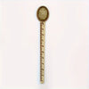 Vintage brass straight ruler with a round, textured tip and minimalist design.