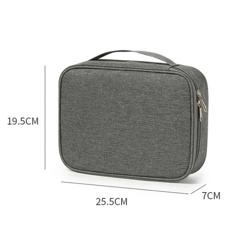 A gray travel cable organizer bag with a zippered closure shown from the top view.