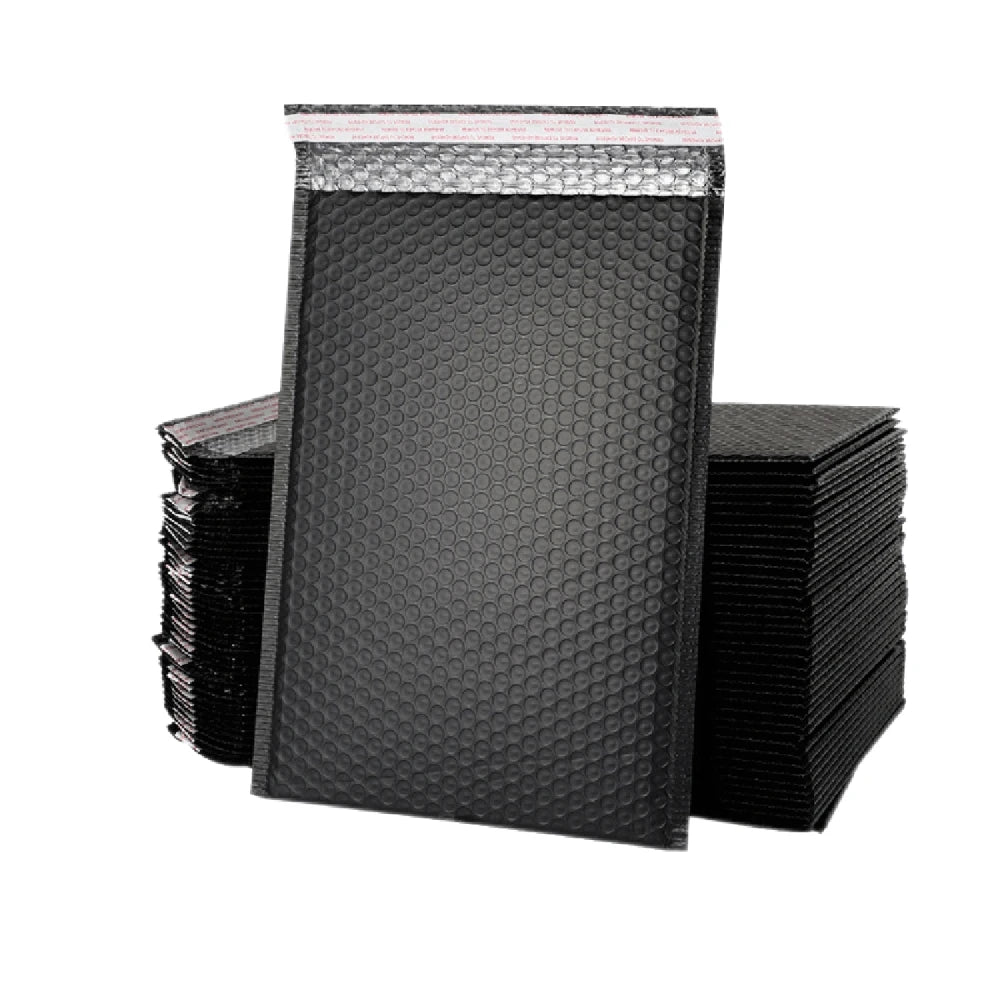 A stack of 50 black bubble mailers for secure shipping.