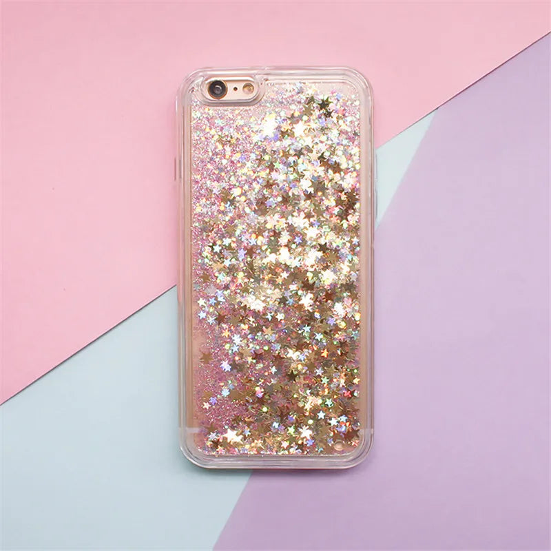 Clear phone case filled with pink and gold glitter stars and hearts against a pastel background.