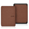 A brown magnetic protective case for a Kindle e-reader is shown on a white surface.