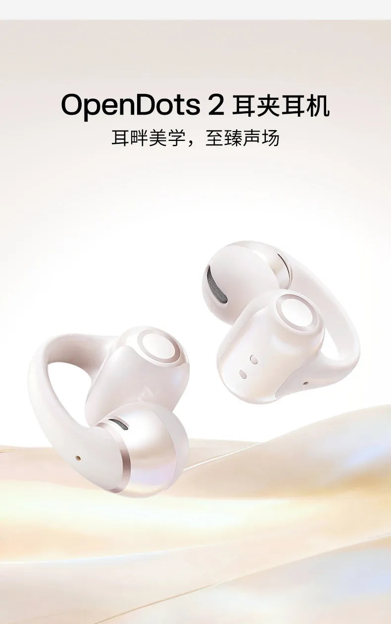 A pair of white OpenDots 2 wireless headphones shown with their charging case, resting on a light background.