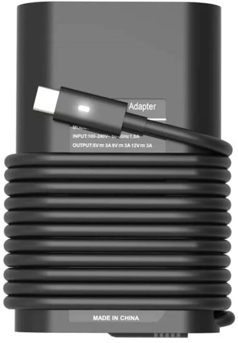 Adaptador de corriente USB Tipo-C negro para portátil con cable enrollado y enchufe adaptador.
