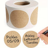 A roll of kraft paper self-adhesive round labels with individual labels showing names and dates