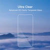 A close-up of a smartphone screen protector labeled Ultra Clear Advanced HD Clarity Tempered Glass against a misty landscape.