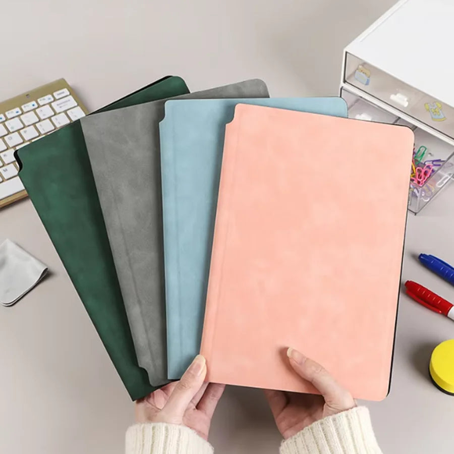 A set of five A5 reusable whiteboard notebooks in various pastel colors, including green, gray, blue, and peach.
