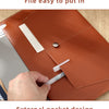 A close-up of a brown leather document organizer bag showing horizontal opening and an external pocket design.