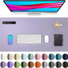A large purple desk mat featuring various color swatches for a laptop and keyboard.