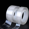 Rolls of heavy duty clear double-sided gap tape shown against a black background.