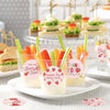 A display of strawberry thank you adhesive stickers in various shades and designs on a white plate.