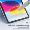 A close-up of an iPad screen showing colorful graphics and a glass protector being applied with a metal tool.