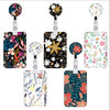 A set of four floral retractable badge reels with various patterns and colors on clear card holders.