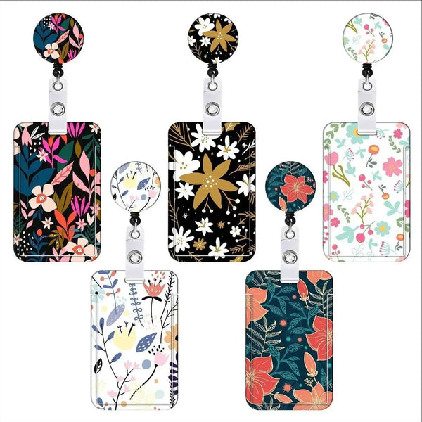 A set of four floral retractable badge reels with various patterns and colors on clear card holders.
