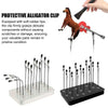 A protective alligator clip tool used to grip delicate components during painting or craft work.