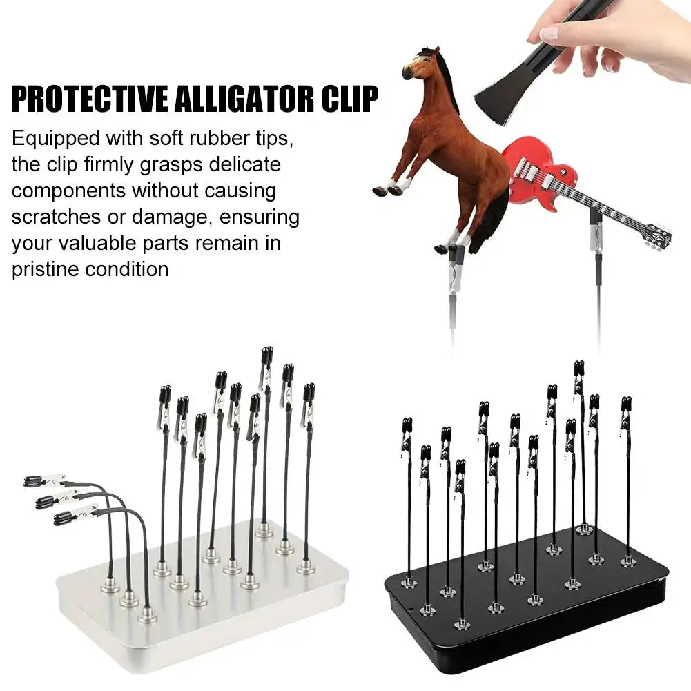 A protective alligator clip tool used to grip delicate components during painting or craft work.