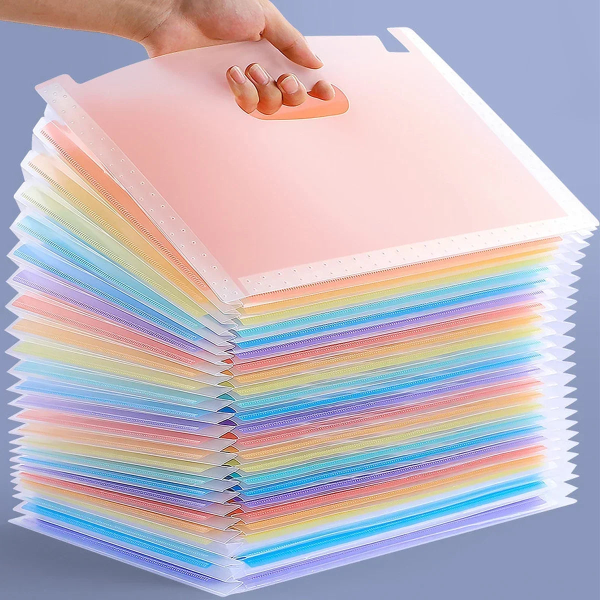 A stack of rainbow colored vertical multi-layer storage files with a hand placing a pink folder on top.