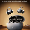 A pair of black wireless headphones and a charging case are displayed against a brown background.