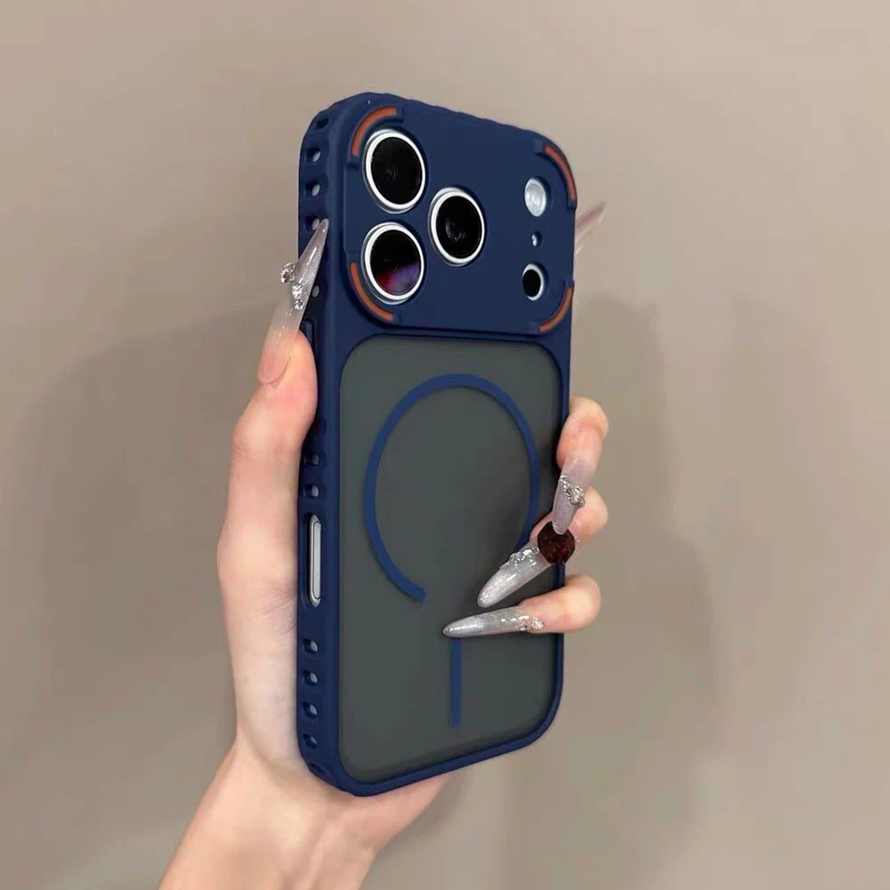 A hand holds a dark blue frosted magnetic silicone case for an iPhone, displaying a circular design.