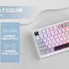 Teclado compacto de membrana blanco con iluminación RGB y perilla giratoria, mostrando varios efectos de color y RGB.