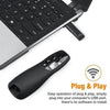 A black wireless presentation pen and remote control are shown next to a laptop keyboard.
