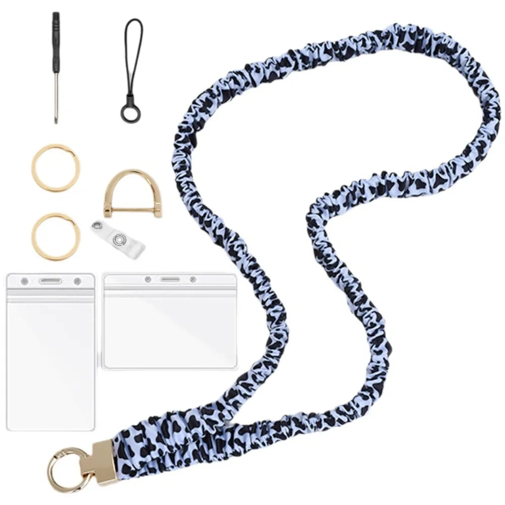 A stylish stretchy breakaway ID badge lanyard with a black and white leopard print design and a retractable reel.
