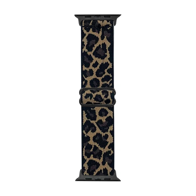 A black nylon Apple Watch band with a leopard print pattern.