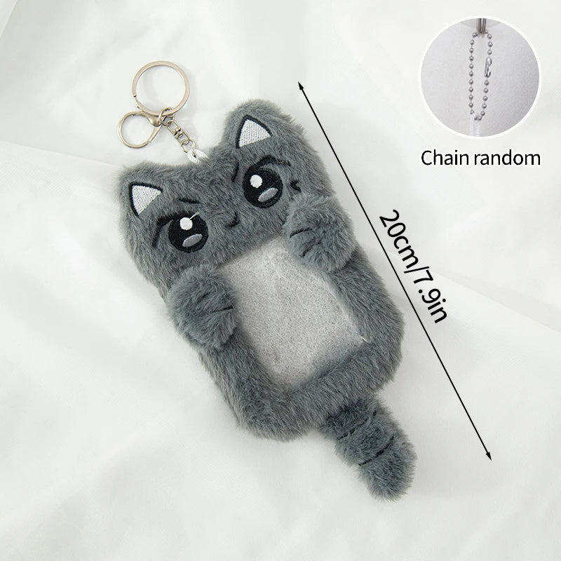 A gray plush cat photocard holder with a soft cover and a chain, shown against a white background.