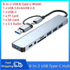 A silver 8-in-2 USB Type-C hub featuring multiple ports including USB, Type-C, TF card reader, SD card slot, and a 3.5 audio 