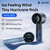 A silver handheld ice feeling wind fan with an LED display is shown resting on a snowy surface.
