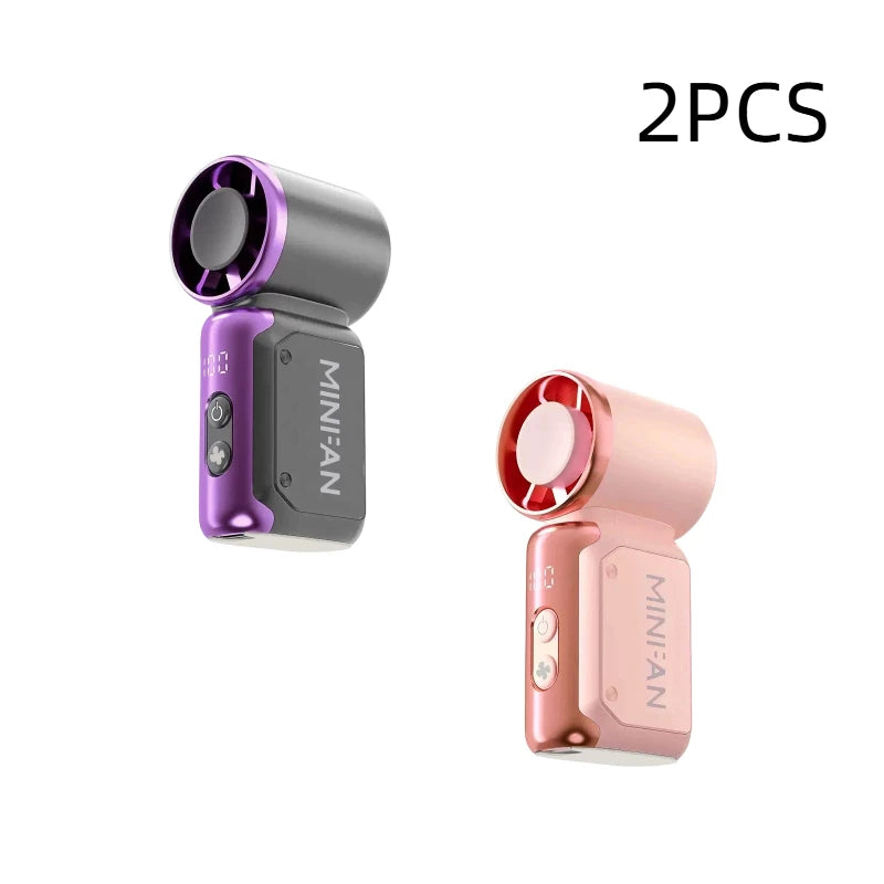 Two portable USB rechargeable mini fans, one purple and one pink.