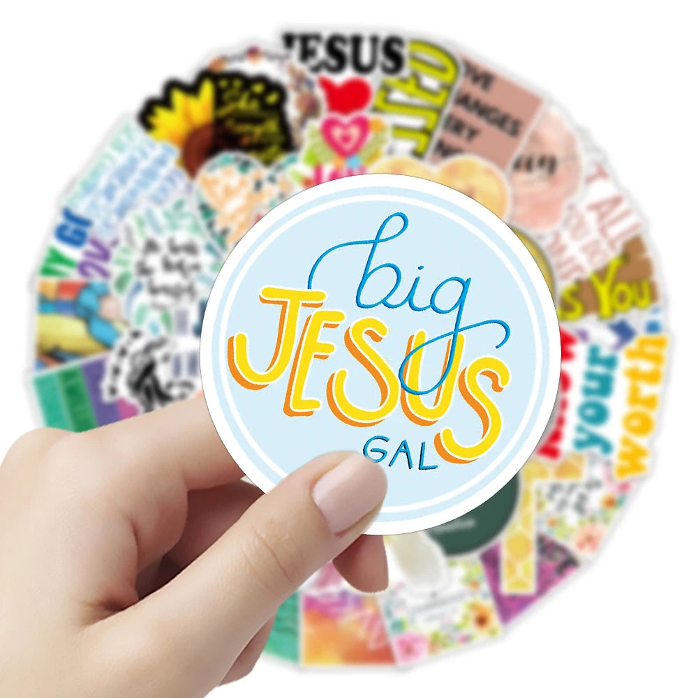 A hand holds a circular arrangement of inspirational Bible verse stickers featuring the text Big Jesus Gal