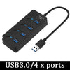 Black USB 3.0/4 hub with four ports, each featuring an individual power switch and LED indicator.
