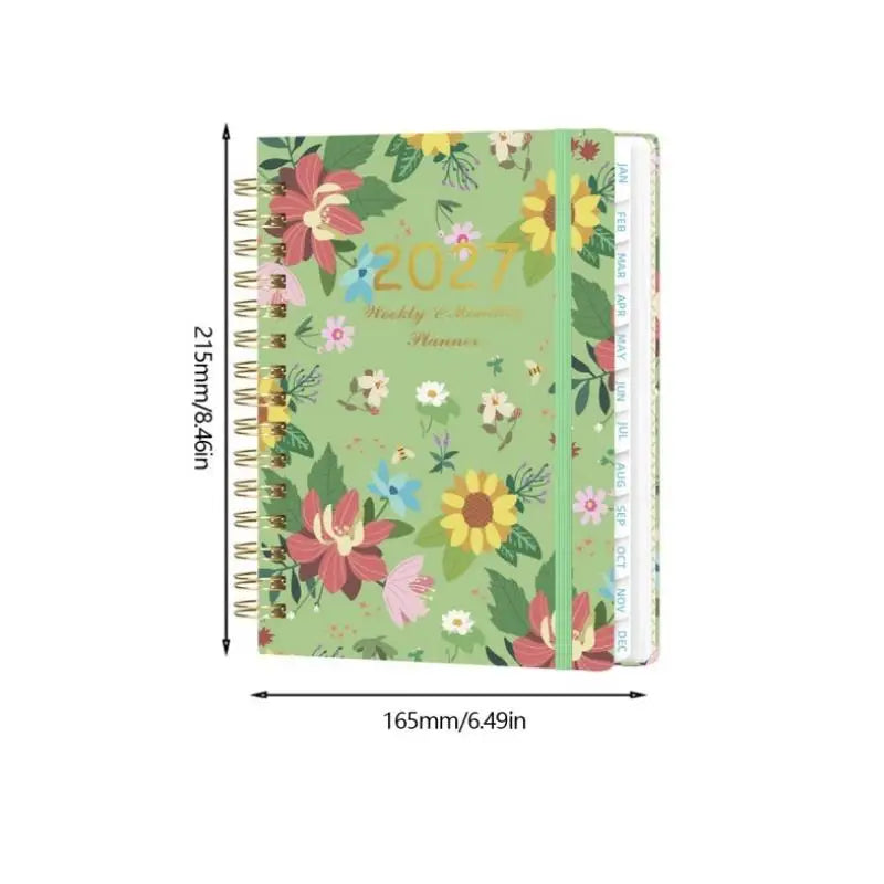 A5 spiral bound planner featuring a light green cover with floral designs and monthly tabs.
