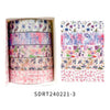 A set of five rolls of floral patterned washi tape in various shades of pink and purple for crafting.