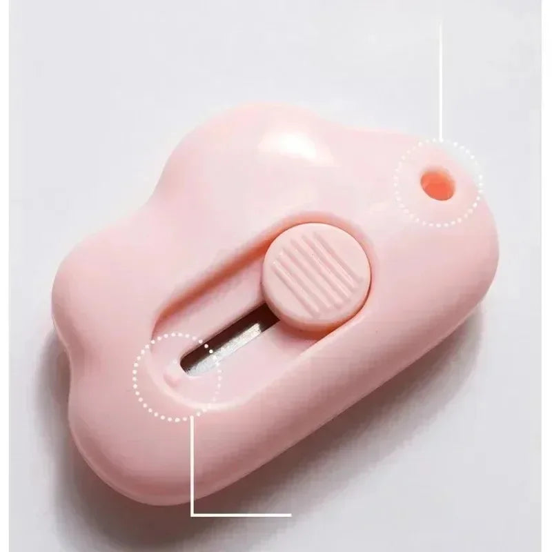 A pink portable rabbit cloud letter opener and crafting tool with a slot for letters.