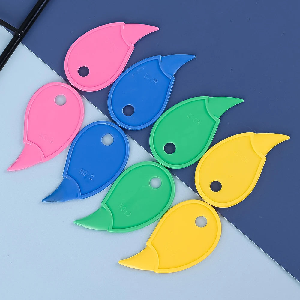 A collection of five brightly colored plastic box openers and cutting tools in pink, blue, green, yellow, and purple.