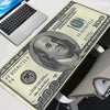 Oversized gaming mouse pad featuring a design of a hundred dollar bill.