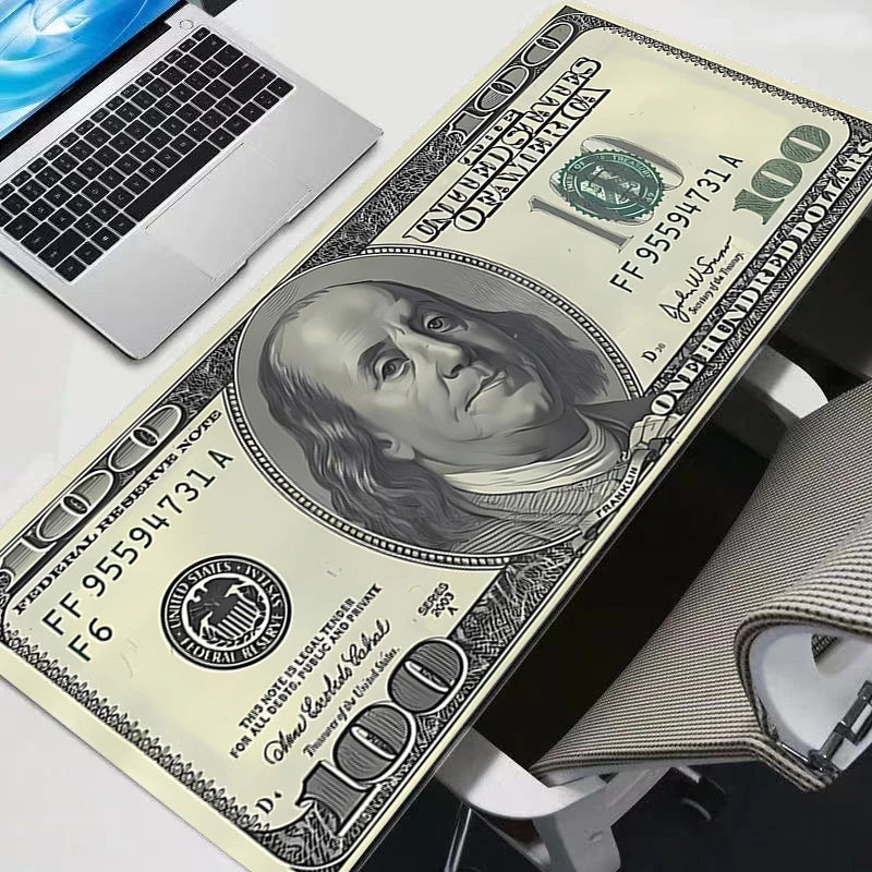 Oversized gaming mouse pad featuring a design of a hundred dollar bill.